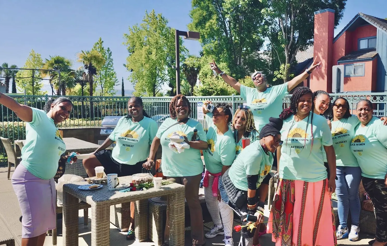 Members of Solutions for Women in matching retreat shirts
