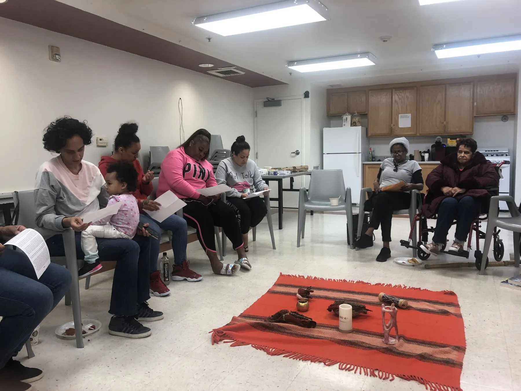 Women seated in a circle during a support group
